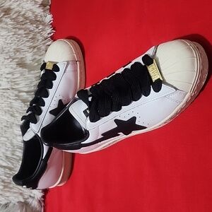 Adidas x BAPE Superstar Shoes in Black and White with Gold Accents